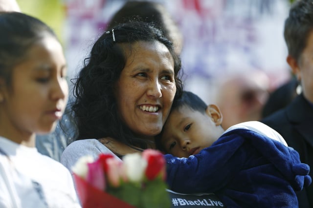 File - Jeanette Vizguerra, a Mexican immigrant who has lived in a church to avoid immigration authorities for the past three months, smiles after leaving the church early Friday, May 12, 2017, in downtown Denver. (AP Photo/David Zalubowski, File)