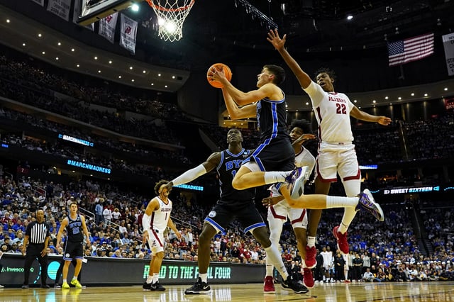 Mar 27, 2025; Newark, NJ, USA; Brigham Young Cougars guard Egor Demin (3) shoots the ball against Alabama Crimson Tide forward Aiden Sherrell (22) during the second half during an East Regional semifinal of the 2025 NCAA tournament at Prudential Center. Mandatory Credit: Robert Deutsch-Imagn Images