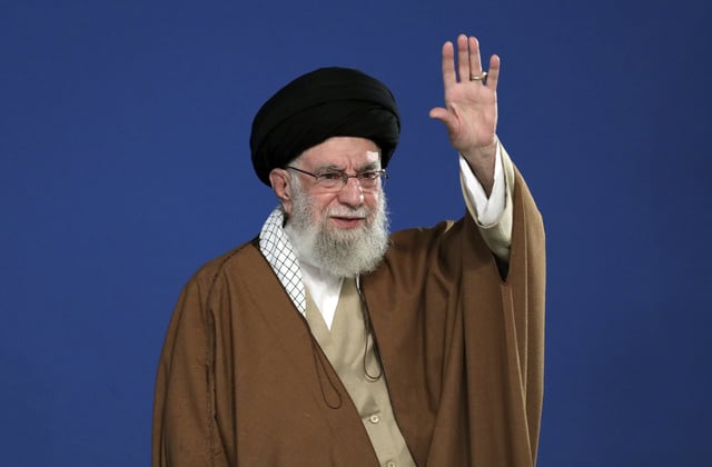 In this photo released by the official website of the office of the Iranian supreme leader, Supreme Leader Ayatollah Ali Khamenei waves to the crowd during his meeting with a group of people and officials in Tehran, Iran, Friday, March 21, 2025.