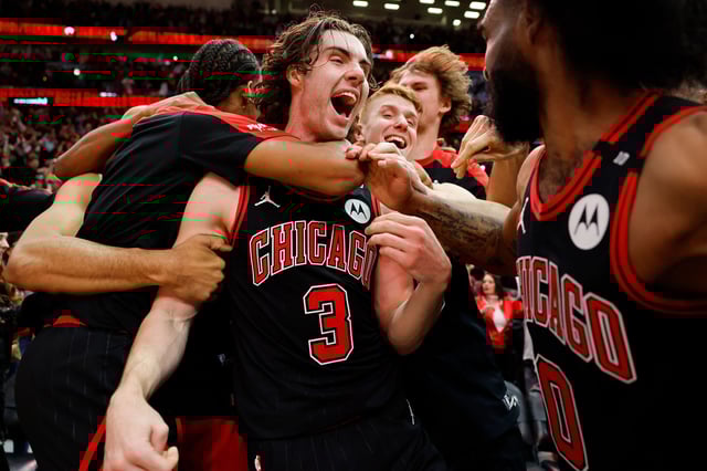 Josh Giddey of the Chicago Bulls celebrates with teammates after hitting a game-winning three pointer as time expired against the Los Angeles Lakers at the United Center in Chicago, Illinois, on March 27, 2025.