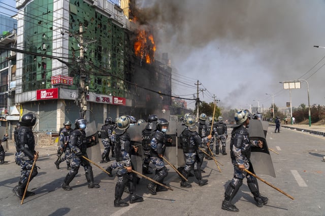 Police secure the site of a house set on fire by a pro-monarchist group during a protest in Kathmandu, Nepal, on Friday, March 28, 2025. (AP Photo/Niranjan Shrestha)