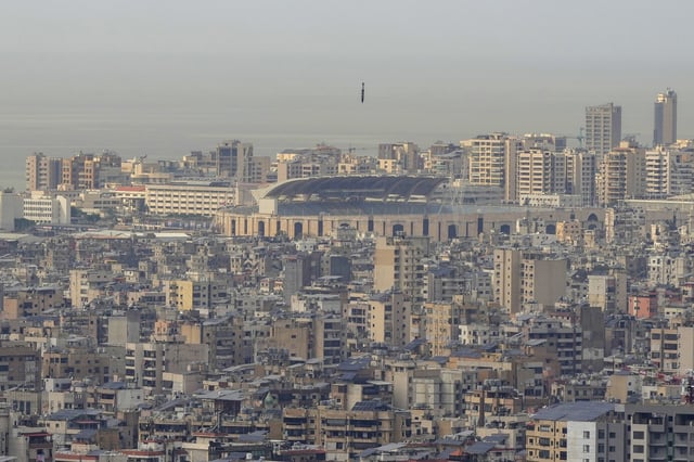 A bomb dropped from an Israeli jet falls before hitting a building in Dahiyeh, in the southern suburb of Beirut, Lebanon, Friday, March 28, 2025. (AP Photo/Hassan Ammar)