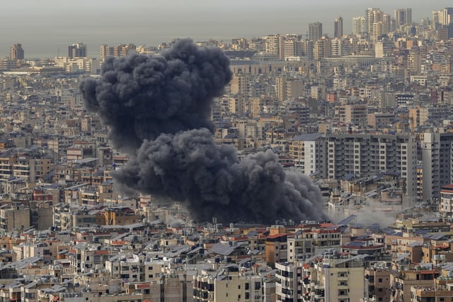 Smoke rises following an Israeli airstrike on Dahiyeh, in the southern suburb of Beirut, Lebanon, Friday, March 28, 2025. (AP Photo/Hassan Ammar)