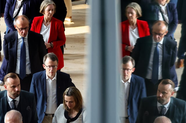 German Chancellor-in-waiting and leader of the Christian Democratic Union party (CDU) Friedrich Merz walks on the day of the inaugural session of the German lower house of Parliament, in Berlin, Germany, March 25, 2025. REUTERS/Fabrizio Bensch/File Photo