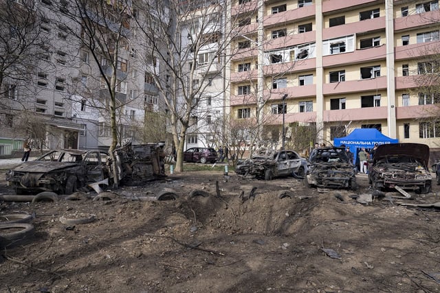 The wreckage of cars remains in a residential district at the site of a Russian drone attack on March 27, 2025 in Dnipro, Ukraine.