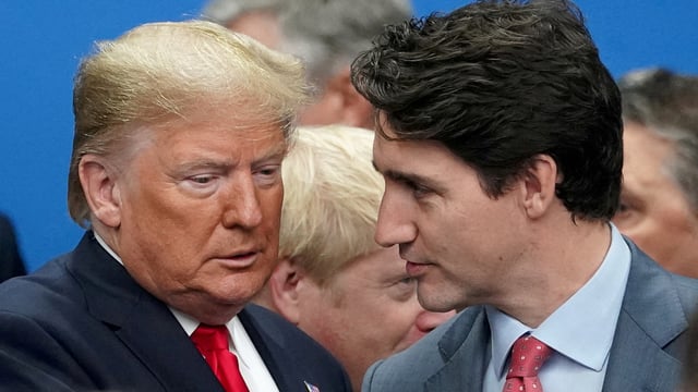 US President Donald Trump talks with Canada's former Prime Minister Justin Trudeau.