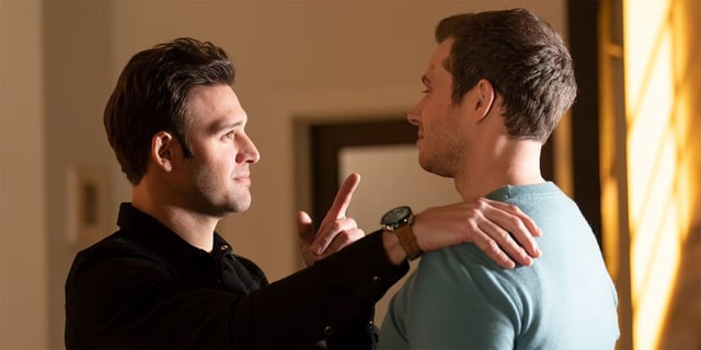 Ryan Guzman as Eddie pointing his finger at Oliver Stark as Buck in 9-1-1 Season 7 