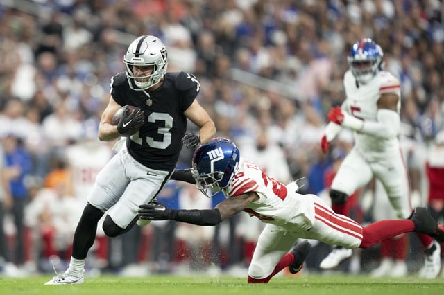 November 5, 2023; Paradise, Nevada, USA; Las Vegas Raiders wide receiver Hunter Renfrow (13) is tackled by New York Giants cornerback Cor'Dale Flott (28) during the second quarter at Allegiant Stadium. Mandatory Credit: Kyle Terada-USA TODAY Sports/File Photo
