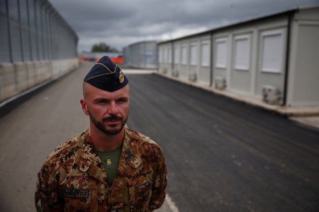 A member of Italian Army is seen at a camp for illegal migrants in Gjader, Albania October 11, 2024. REUTERS/Florion Goga/File Photo