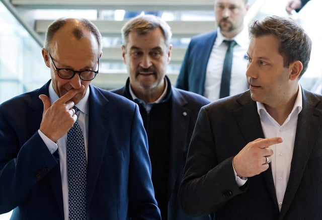 The leader of Germany's Christian Democratic Union (CDU) Friedrich Merz, the leader of the conservative Christian Social Union (CSU) Markus Soeder and the co-leader of Germany's Social Democratic Party (SPD) Lars Klingbeil arrive to attend the main negotation group meeting for coalition talks between SPD CDU/CSU at the SPD headquarters in the Willy-Brandt-Haus in Berlin on March 28, 2025.     ODD ANDERSEN/Pool via REUTERS