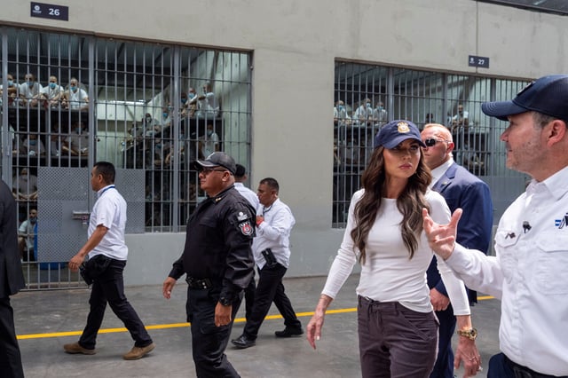 Minister of Justice and Public Security Hector Villatoro accompanies U.S. Homeland Security Secretary Kristi Noem during a tour of the Terrorist Confinement Center in Tecoluca, El Salvador on March 26, 2025.