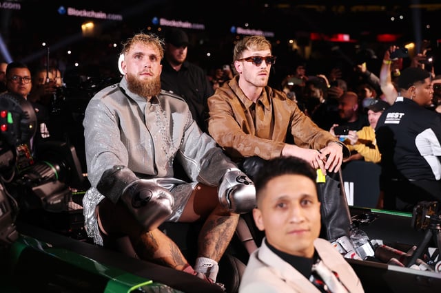 ARLINGTON, TEXAS - NOVEMBER 15: (L-R) Jake Paul and Logan Paul enter during LIVE On Netflix: Jake Paul vs. Mike Tyson at AT&amp;T Stadium on November 15, 2024 in Arlington, Texas.