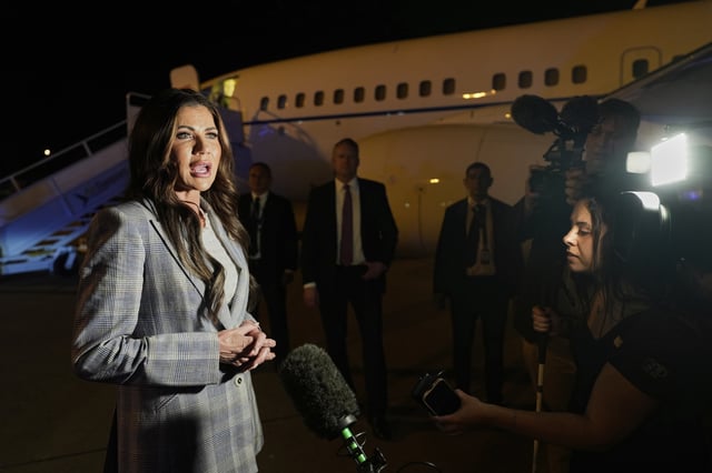Homeland Security Secretary Kristi Noem takes questions from the press before boarding her plane to Colombia at Comalapa International Airport in San Salvador, El Salvador, Wednesday, March 26, 2025. (AP Photo/Alex Brandon)
