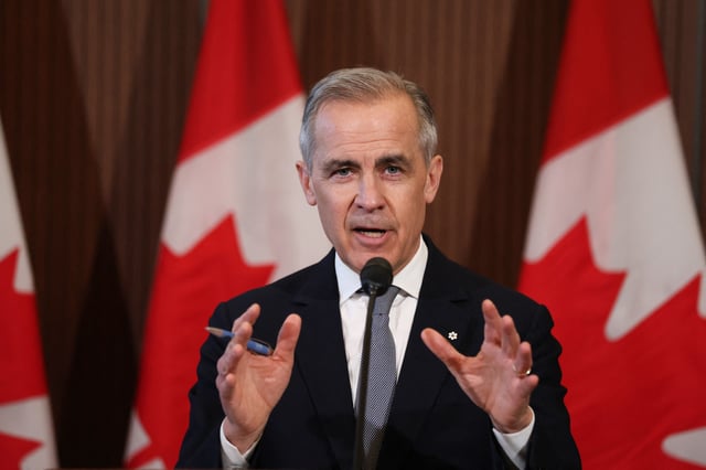 Canada&#39;s Prime Minister Mark Carney speaks to the media after meeting with his cabinet to deal with the US auto tariffs on March 27, 2025 on Parliament Hill in Ottawa.