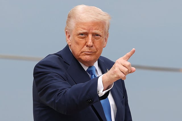 U.S. President Donald Trump gestures, before boarding Air Force One as he departs for Florida, at Joint Base Andrews, Maryland, U.S., March 28, 2025. REUTERS/Kevin Lamarque