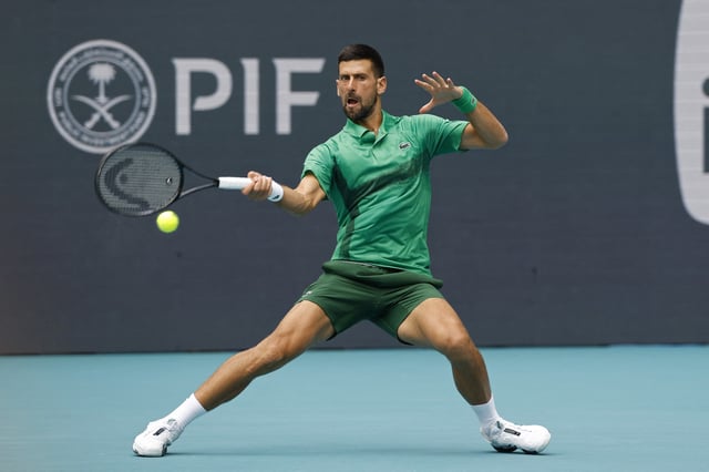 Mar 28, 2025; Miami, FL, USA; Novak Djokovic (SRB) hits a forehand against Grigor Dmitrov (BUL)(not pictured) in a men's singles semifinal on day eleven of the Miami Open at Hard Rock Stadium. Mandatory Credit: Geoff Burke-Imagn Images