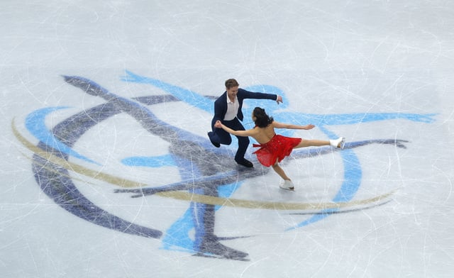 Figure Skating - ISU World Championships - TD Garden, Boston, Massachusetts, U.S. - March 28, 2025 Madison Chock and Evan Bates of the U.S. perform during the ice dance rhythm dance REUTERS/Brian Snyder