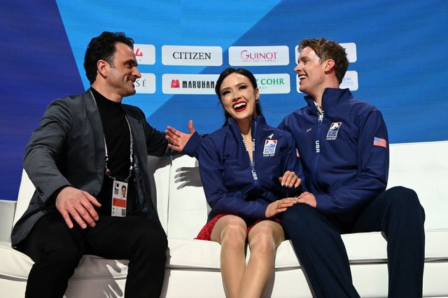 Mar 28, 2025; Boston, Massachusetts, USA; Madison Chock (USA) and Evan Bates (USA) react to their score in the rhythm ice dance during the ISU World Figure Skating Championships at TD Garden. Mandatory Credit: Brian Fluharty-Imagn Images