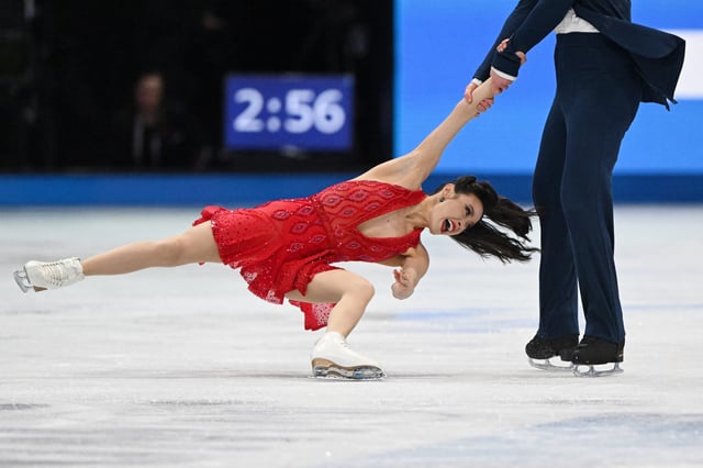 Mar 28, 2025; Boston, Massachusetts, USA; Madison Chock (USA) and Evan Bates (USA) compete in the rhythm ice dance during the ISU World Figure Skating Championships at TD Garden. Mandatory Credit: Brian Fluharty-Imagn Images
