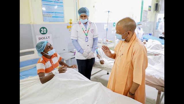 UP chief minister Yogi Adityanath meets children affected by food poisoning, at Lok Bandhu Raj Narayan Combined Hospital in Lucknow on Friday. (Sourced)