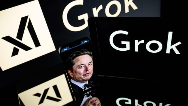 Screens display the logos of xAI and Grok, the AI chatbot developed by Elon Musk's xAI, in this photo illustration taken on January 13, 2025, in Toulouse. Musk announced on March 28, 2025, that xAI is acquiring X (formerly Twitter) in a deal valuing it at $33 billion.
