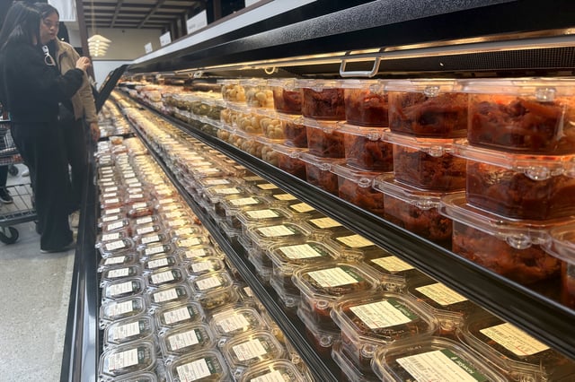 Customers peruse the groceries in the grab-and-go section of Jagalchi market in Daly City, on Friday, March 28, 2025. 