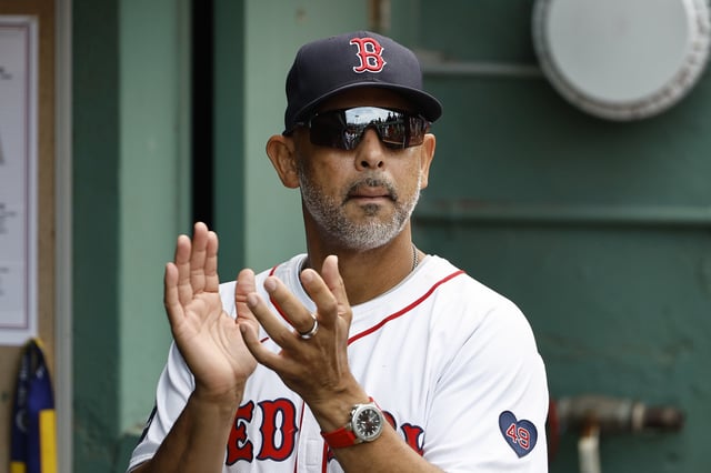 BOSTON, MA - AUGUST 25: Manager Alex Cora #13 of the Boston Red Sox in the dugout before their game against the Arizona Diamondbacks at Fenway Park on August 25, 2024 in Boston, Massachusetts.