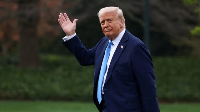 US President Donald Trump waves as he walks before departing for Florida from the South Lawn at the White House in Washington, D.C., U.S., March 28, 2025. 