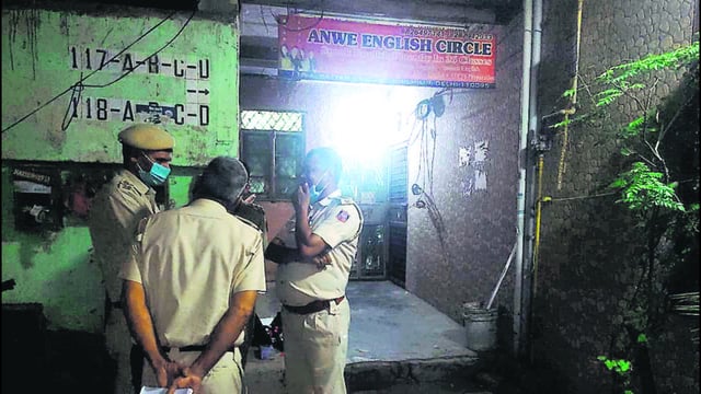 Police outside the house from where the body was recovered, in east Delhi’s Vivek Vihar on Friday. (HT PHOTO)