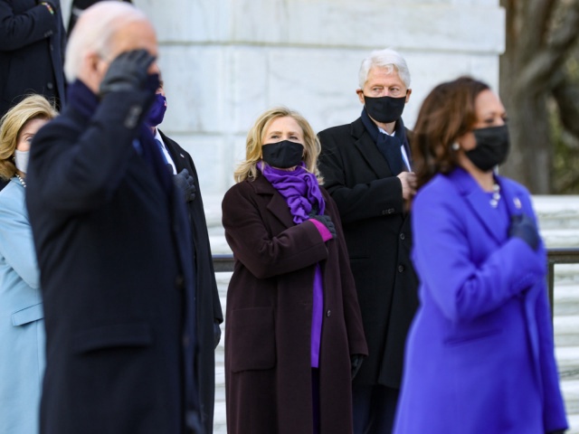 U.S. President Joe Biden and Vice President Kamala Harris attend a wreath-laying ceremony at Arlington National Cemetery's Tomb of the Unknown Soldier after the 59th Presidential Inauguration ceremony at the U.S. Capitol, as former U.S. President George W. Bush and Laura Bush, and former U.S. President Bill Clinton and former Secretary of State Hillary Clinton look on, January 20, 2021 in Arlington, Virginia. During today's inauguration ceremony Joe Biden becomes the 46th president of the United States. (Photo by Chip Somodevilla/Getty Images)