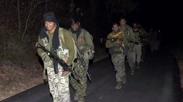 Security personnel return after an encounter in which 16 naxals were killed on January 21, in Gariaband.