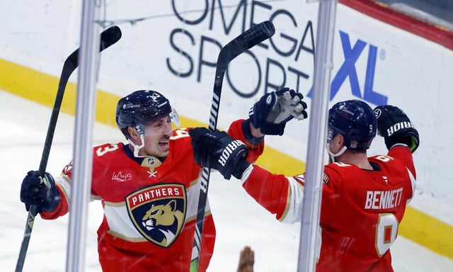 Florida Panthers newcomer Brad Marchand celebrates the game-winning goal Friday night with Sam Bennett. in Sunrise, (AP Photo/Rhona Wise)