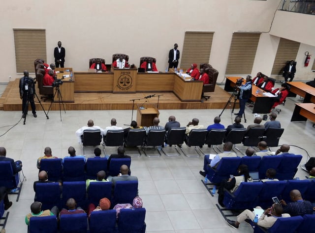 Guinea's former military junta leader Moussa Dadis Camara and other co-defendants enter the courtroom to attend the verdict in which he and seven others were found guilty of crimes against humanity for a 2009 stadium massacre in which more than 150 pro-democracy protesters were gunned down, in Conakry, Guinea, July 31, 2024. REUTERS/Souleymane Camara/File Photo