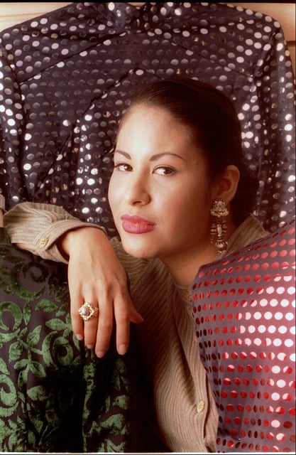 Tejano music star Selena poses March 7, 1995, in Corpus Christi, Texas, while wearing a ring given to her by Yolanda Saldivar. Selena was shot at the Days Inn motel in Corpus Christi on March 31, 1995. Saldivar, who is on trial in Houston, is accused of murdering Selena. (AP Photo/Paul Howell, Houston Chronicle)