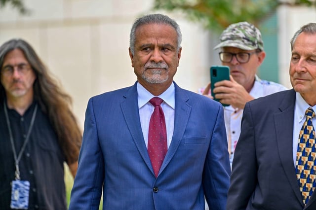 Former Anaheim Mayor Harry Sidhu (center) leaves Federal court after pleading guilty in connection to charges related to the sale of Angel Stadium in Santa Ana, CA, on Friday, Sept. 15, 2023.  He pleaded guilty in 2023 to four felonies: obstruction of justice, wire fraud and two counts of making false statements to a federal agency.(Photo by Jeff Gritchen, Orange County Register/SCNG)