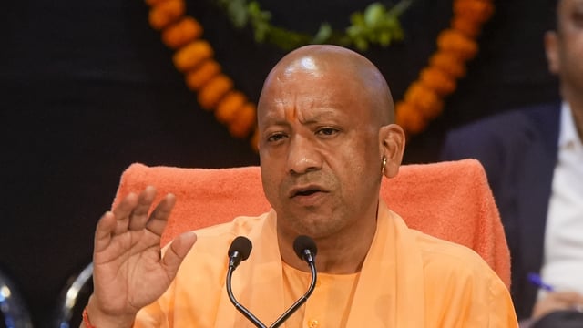 : Uttar Pradesh Chief Minister Yogi Adityanath addresses a press conference on the completion of eight years of the state government, in Lucknow, March 24, 2025. 