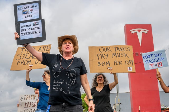 Protesters demonstrate against Tesla CEO Elon Musk’s Department of Government Efficiency (DOGE) initiatives during a nationwide “Tesla Takedown” rally at a dealership on March 29, 2025 in Austin, Texas.