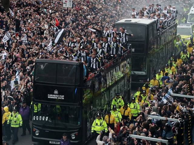 Soccer Football - Carabao Cup - Newcastle United Victory Parade - Newcastle, Britain - March 29, 2025 Newcastle United players celebrate on the bus during the victory parade REUTERS/Scott Heppell