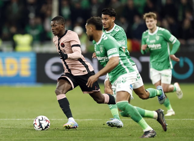 Soccer Football - Ligue 1 - AS Saint-Etienne v Paris St Germain - Stade Geoffroy-Guichard, Saint-Etienne, France - March 29, 2025 Paris St Germain's Nuno Mendes in action REUTERS/Benoit Tessier