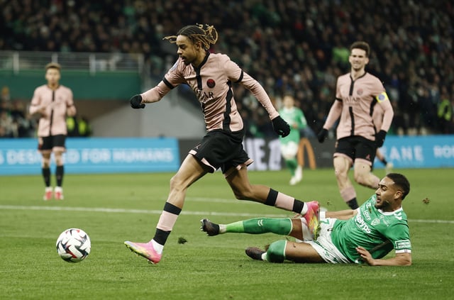 Soccer Football - Ligue 1 - AS Saint-Etienne v Paris St Germain - Stade Geoffroy-Guichard, Saint-Etienne, France - March 29, 2025 Paris St Germain's Bradley Barcola in action with AS Saint-Etienne's Yvann Macon REUTERS/Benoit Tessier