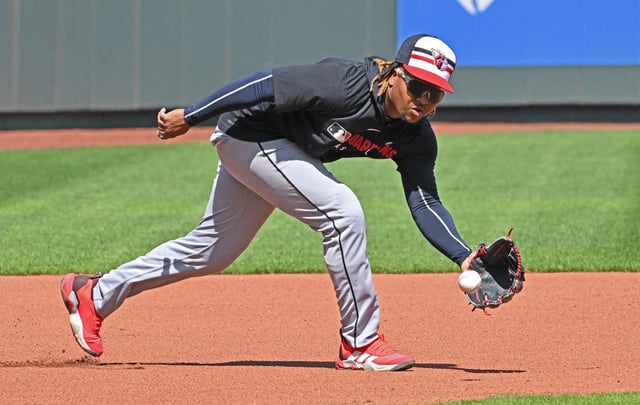 Mar 29, 2025; Kansas City, Missouri, USA; Cleveland Guardians third baseman Jose Ramirez (11) fields a ground ball during batting practice before a game against the Kansas City Royals at Kauffman Stadium. Peter Aiken-Imagn Images