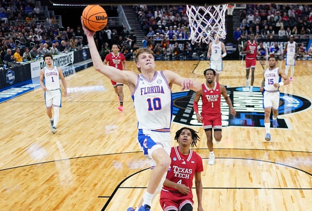 Florida forward Thomas Haugh (10) dunks as Texas Tech guard Christian Anderson tries to defend during the West Regional final of the 2025 NCAA men's tournament at Chase Center.