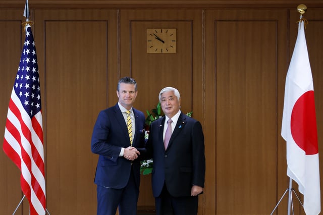 Pete Hegseth, US secretary of defense, and Gen Nakatani, Japan's defense minister, shake hands while posing for photographs prior to their meeting at the Ministry of Defense in Tokyo, Japan, on Sunday, March 30, 2025. Kiyoshi Ota/Pool via REUTERS
