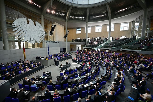 Merz speaks at the Bundestag during its vote to remove the debt brake in Berlin, March 18, 2025.