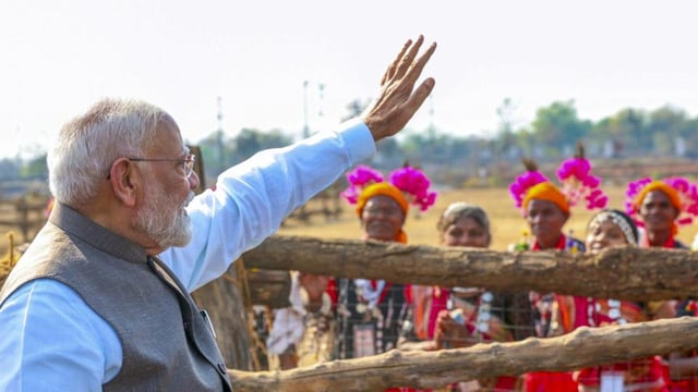 Prime Minister Narendra Modi greets supporters upon his arrival during the foundation stone laying and inauguration of multiple development projects, in Bilaspur, Chhattisgarh, on Sunday. (PMO)