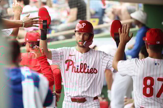 Mar 24, 2025; Clearwater, Florida, USA; Philadelphia Phillies shortstop Trea Turner (7) is congratulated after he scored a run during the first inning against the Tampa Bay Rays  at BayCare Ballpark. Mandatory Credit: Kim Klement Neitzel-Imagn Images/File Photo
