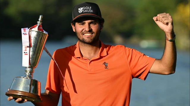 Eugenio Chacarra of Spain poses with the trophy after winning the DP World Tour Hero Indian Open golf in Gurugram. (AFP)