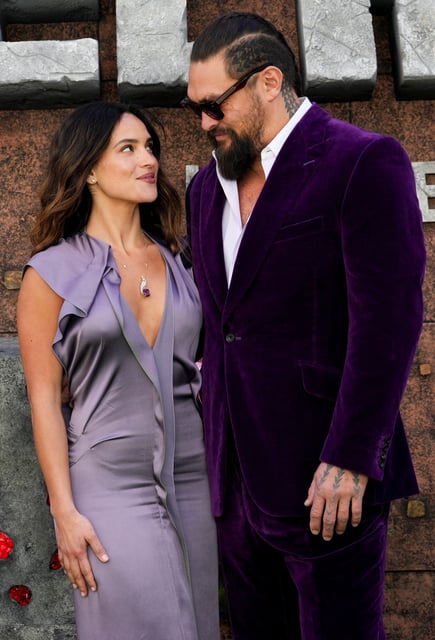 Cast member Jason Momoa and partner Adria Arjona attend the world premiere of ''A Minecraft Movie'', in London, Britain, March 30, 2025.