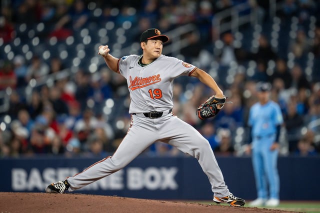 Baltimore Orioles pitcher Tomoyuki Sugano throws during first-inning baseball game action against the Toronto Blue Jays in Toronto, Sunday, March 30, 2025. (Christopher Katsarov/The Canadian Press via AP)