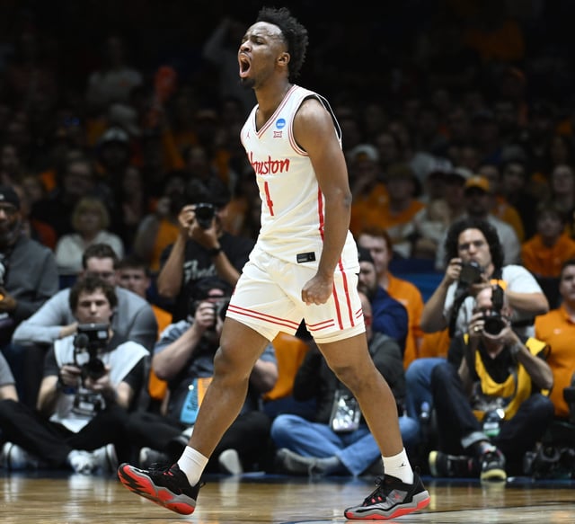 Houston guard L.J. Cryer (4) celebrates a play against Tennessee during the Midwest Regional final of the 2025 NCAA men's tournament at Lucas Oil Stadium.